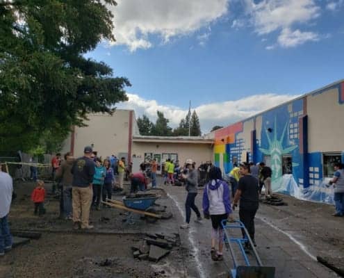 Depave Work Party 2018, group ripping up pavement at Inukai Club