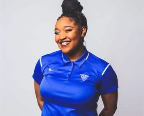 Regence Volunteer Janessa Henry poses in a blue Nike t-shirt for her profile picture.